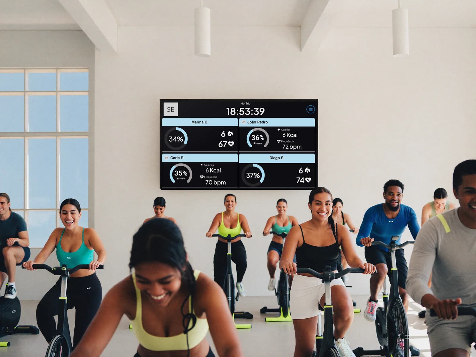 Group class with the Vektor Pulse TV showing each member's live heart-rate data